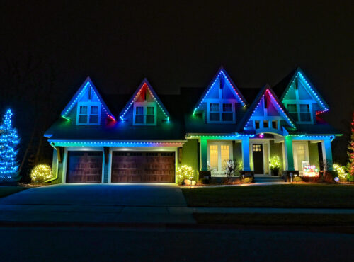 Trimlight of Long Island lighting permanent outdoor programmable lighting system installed on a house.